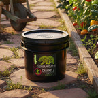 A 25 lb bucket of Flower Republic Channel 2 fertilizer in a garden. 