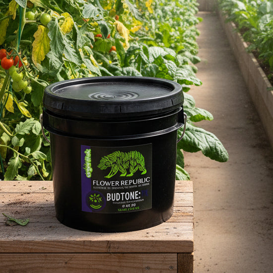 A 25lb pail of Organitek's Flower Republic BudTone:PK Powdered Nutrient Solution with a purple and green label.